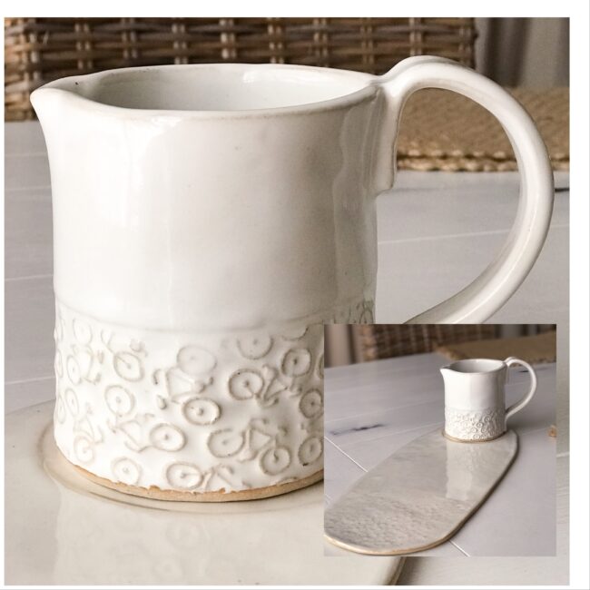 handmade pitcher with bicycle embossing