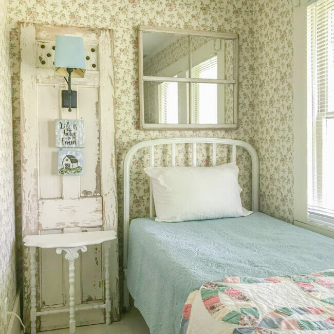 twin bed, door floor lamp and mirrored window