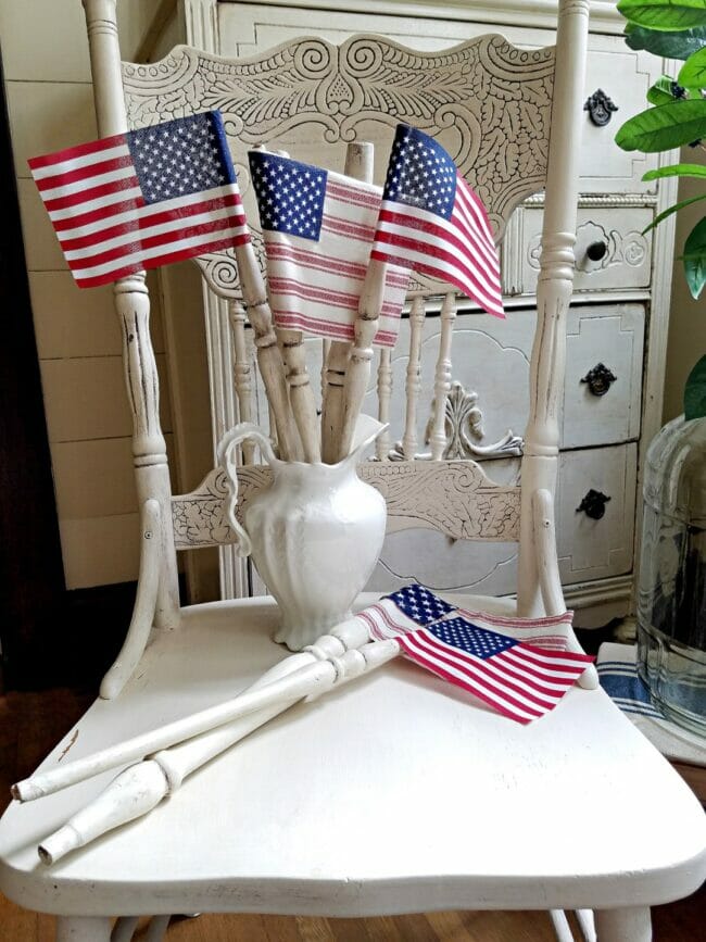 white chair with flags made from spindles