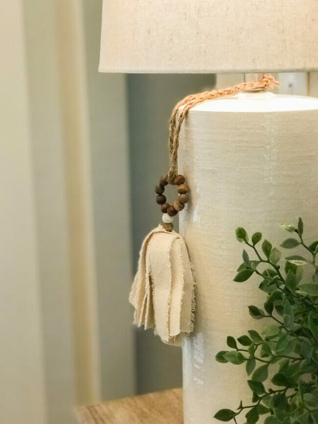 white lamp with napkin ring hanging off switch