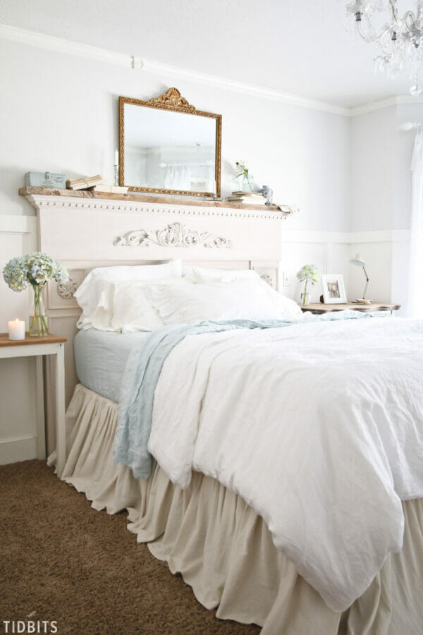 bed with mantel and mirror as headboard