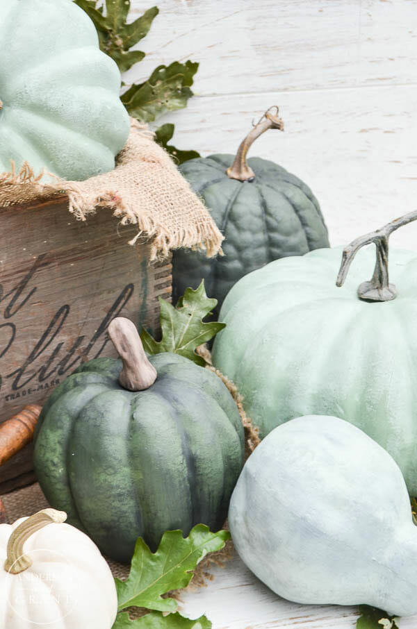stack of green pumpkins with crate