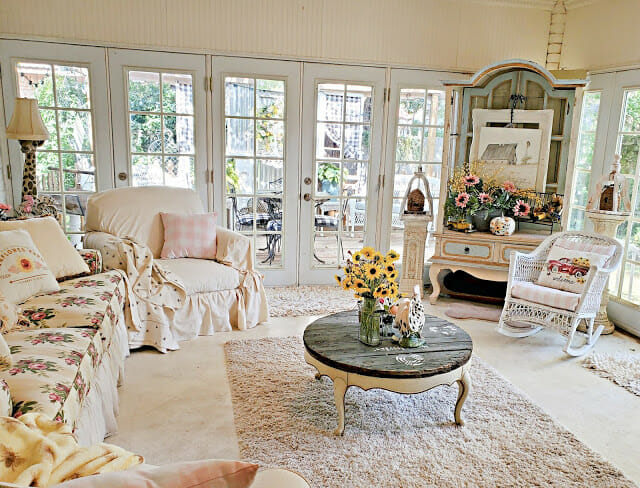 shabby chic room with sofa and sunflowers