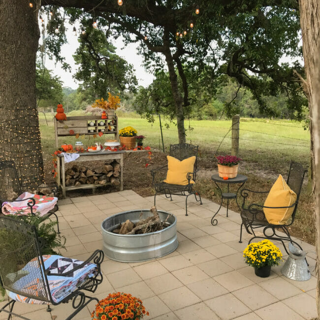 firepit with seating and side dessert table