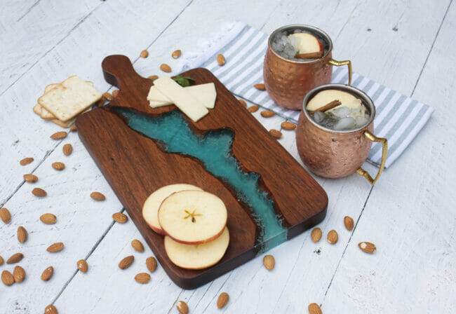 wood charcuterie board with resin and copper cups