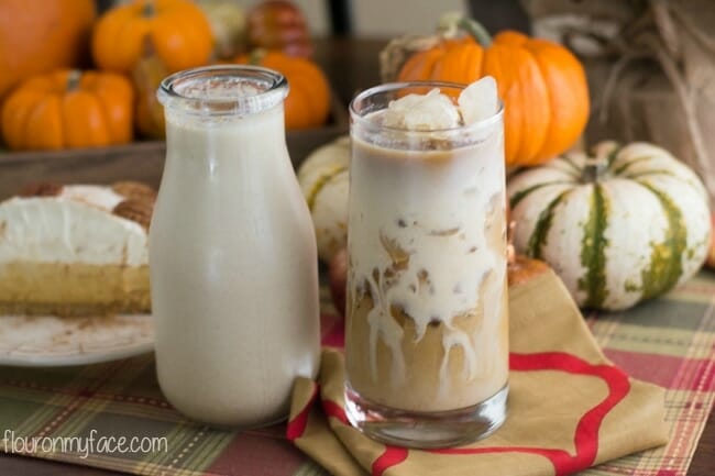 latte in glass with pumpkins
