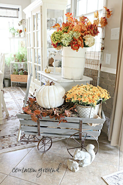 wagon with pumpkin, mums and florals