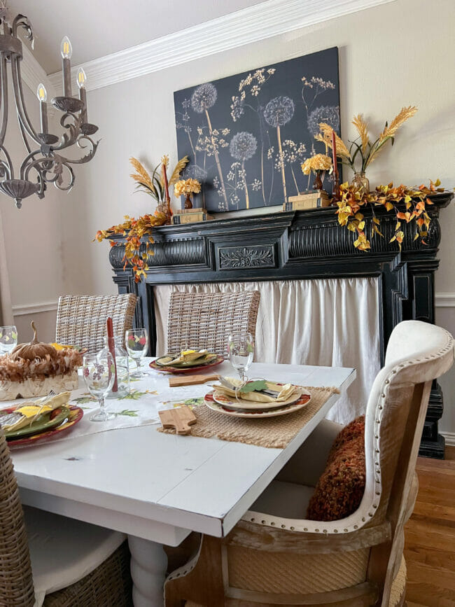 fall table with black mantel dressed for fall