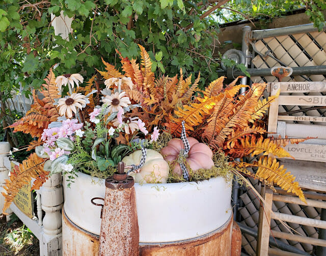 old washing machine with pumpkins and faux stems