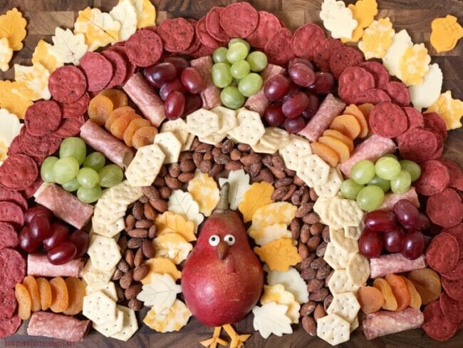 appetizer board shaped like a turkey with snacks