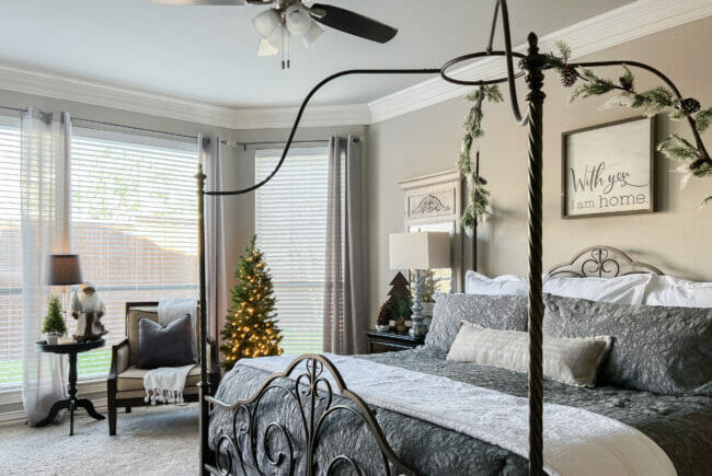 full view of bedroom with canopy bed and Christmas tree