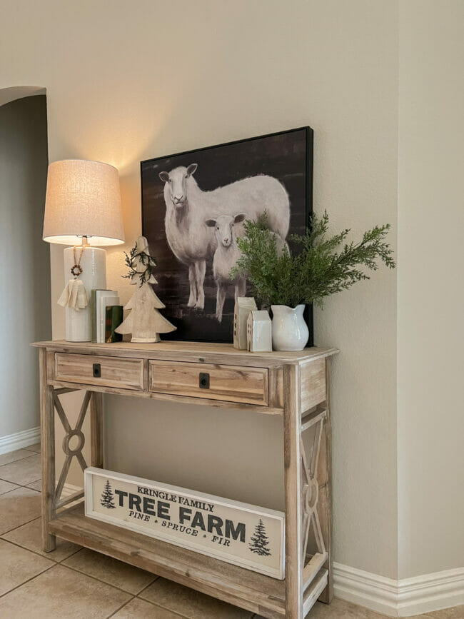 console table with lamp print, lamp and Christmas decor