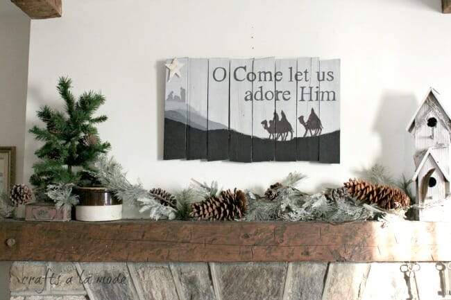 Bethlehem sign over mantel with greenery