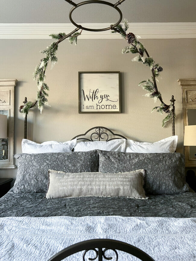 bed with canopy and Christmas garland