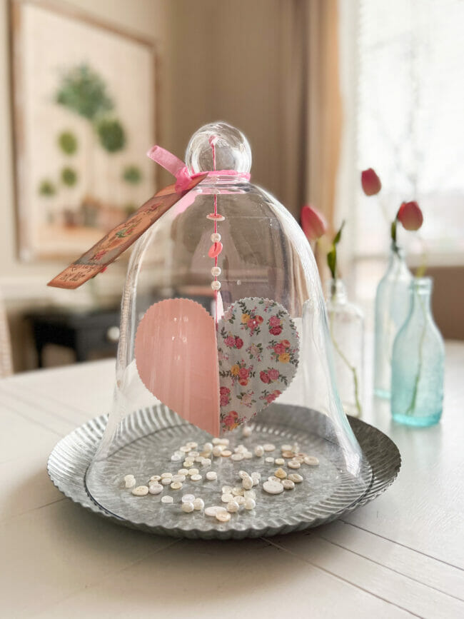 glass cloche with hanging heart and buttons