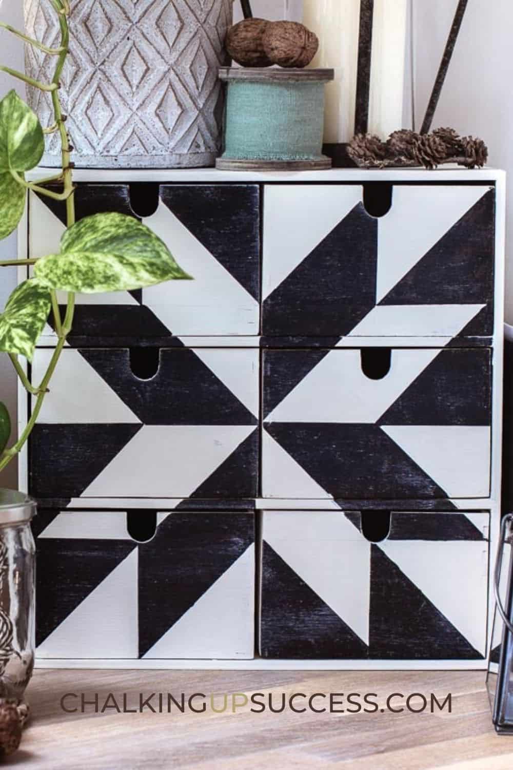 black and white quilt square painted on box shelf