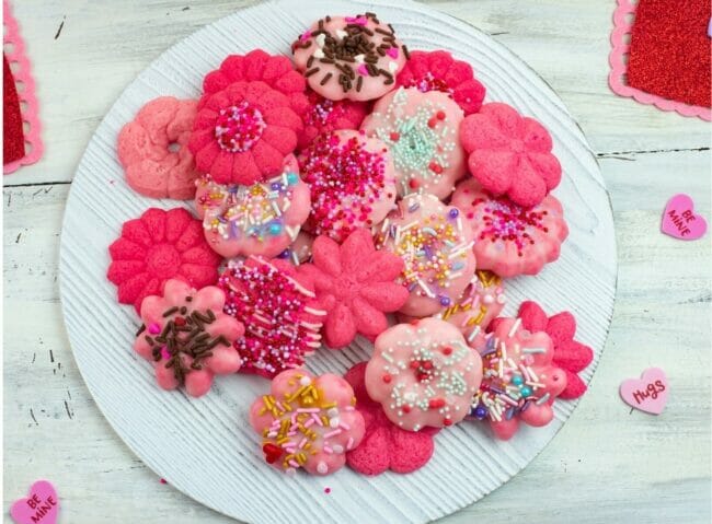 pink spritz cookies on a place