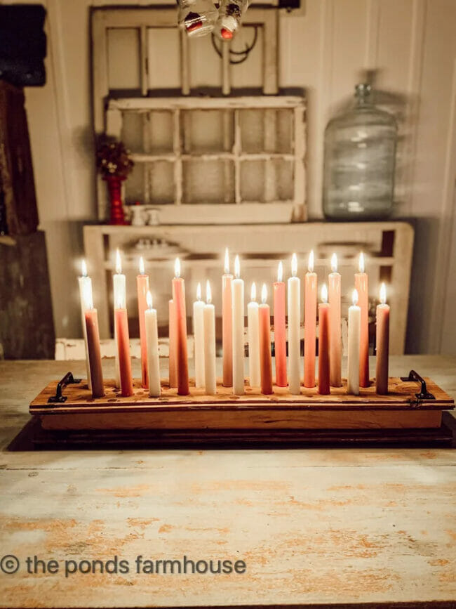 table with lit tapered candles