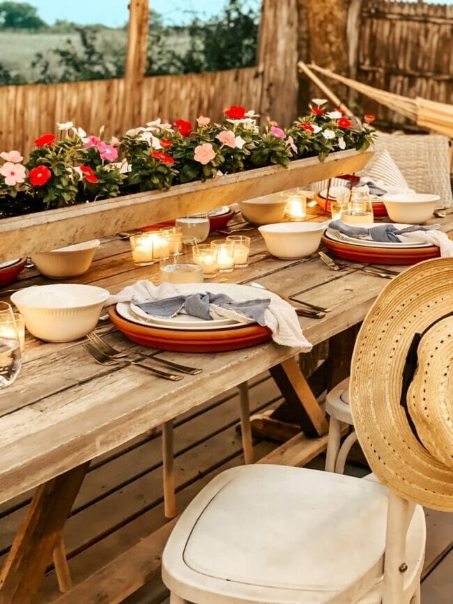 tablescape with flower chicken feeder and plates