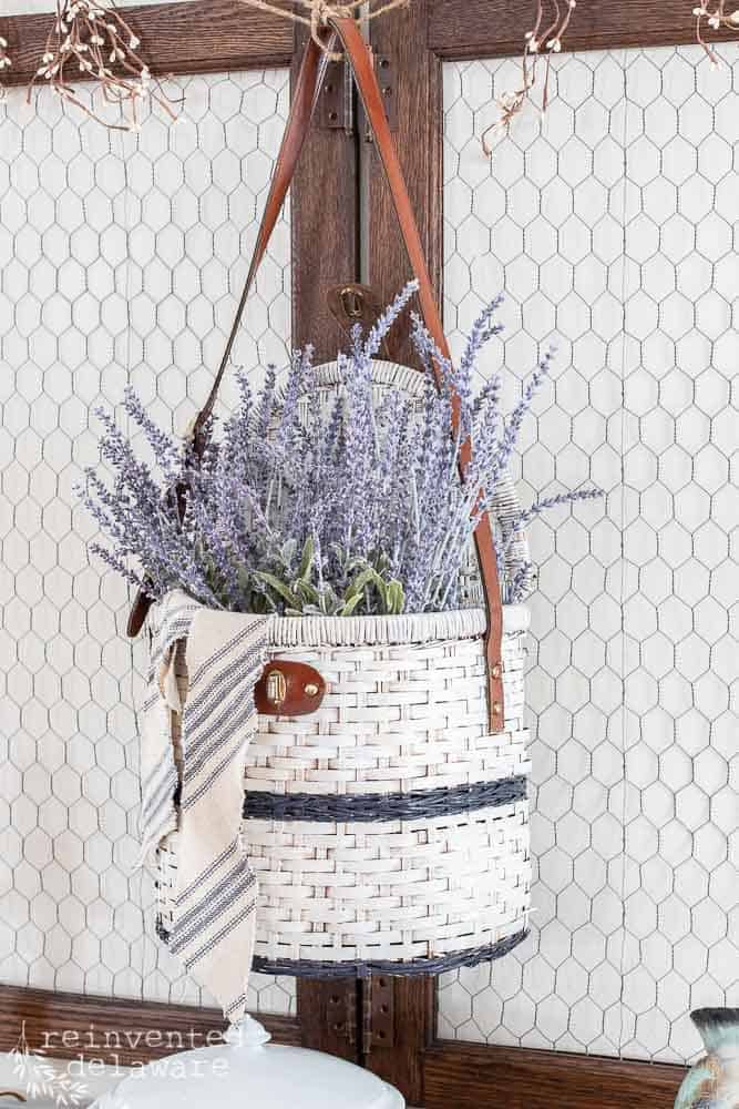 white painted hanging basket with lavender inside