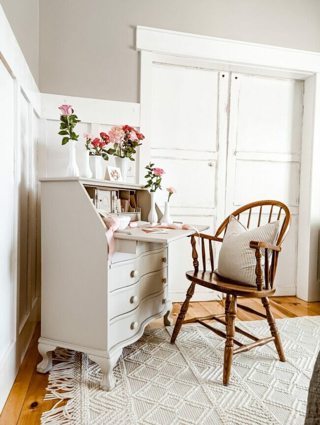 secretary desk and chair with flowers