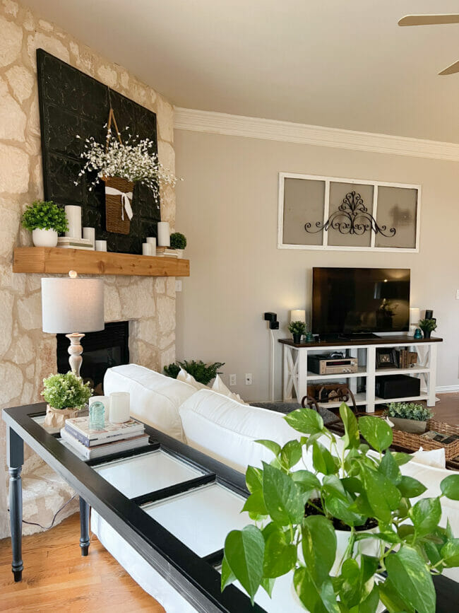 black sofa table, mantel and tv