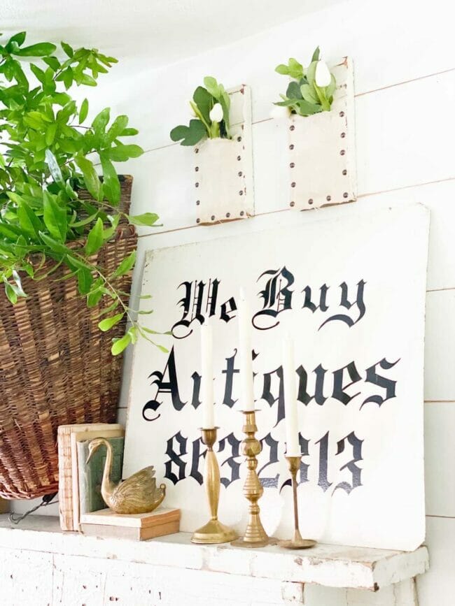 antiques sign with plant in basket