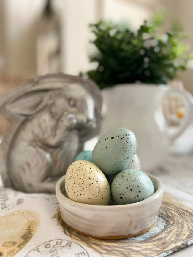 eggs in a white bowl with silver bunny