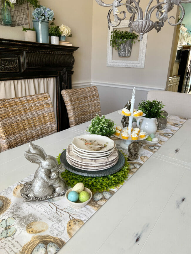 spring tablescape with dishes, bunnies and eggs