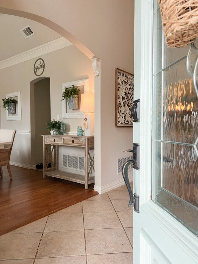 open front door with dining room view