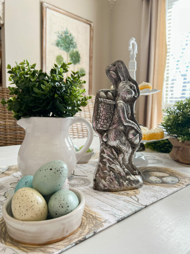 pewter bunny mold, white pitcher with greenery and eggs