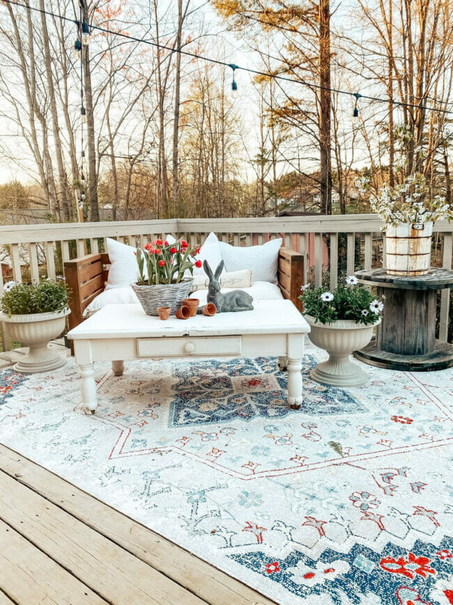 outdoor patio with white table and planters