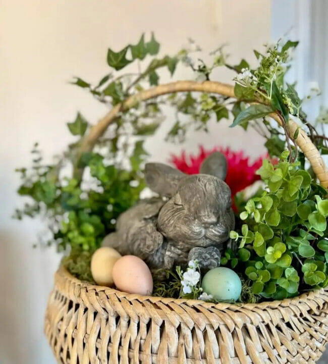 basket with concrete bunny, eggs and ivy