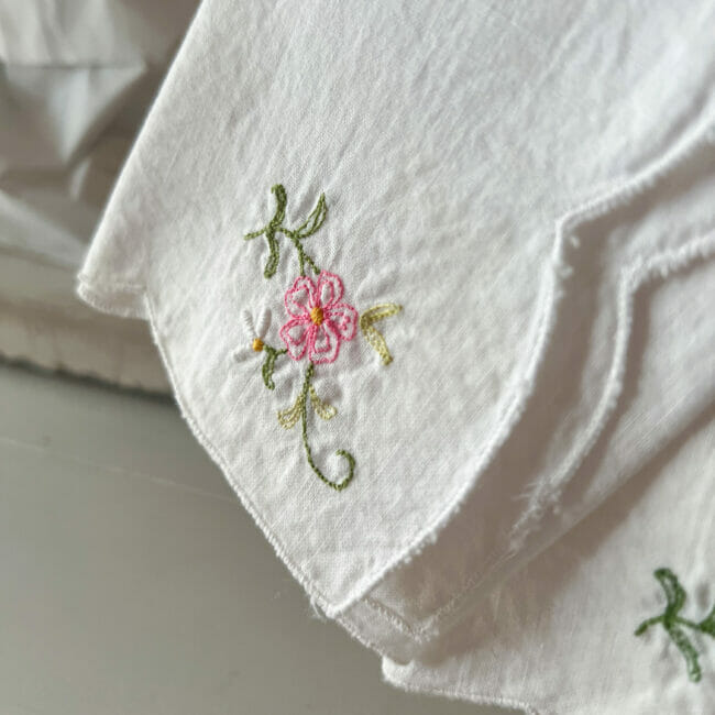 Close up of vintage napkins with pink flowers