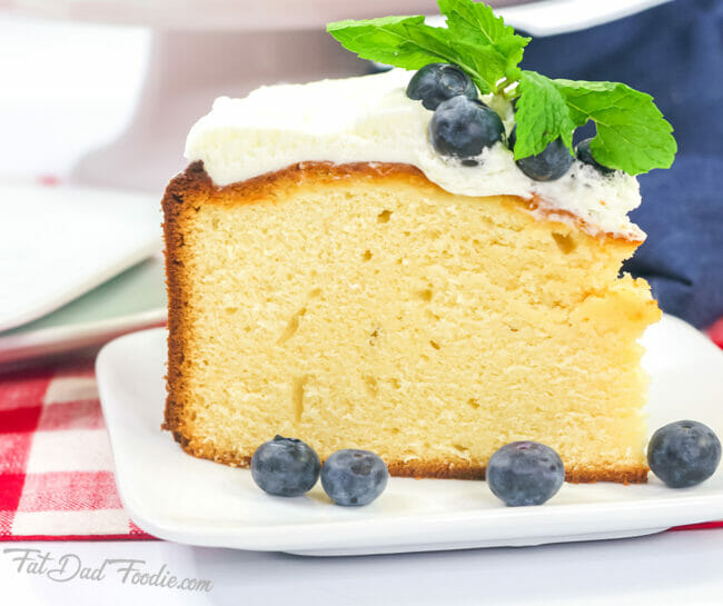 yellow cake with blueberries and mint leaves