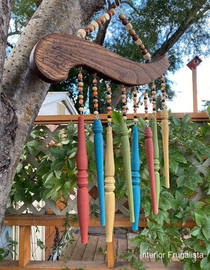 wooden chair spindle wind chime hanging on tree