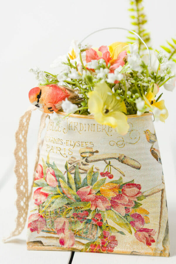 tin can with orange and yellow flowers