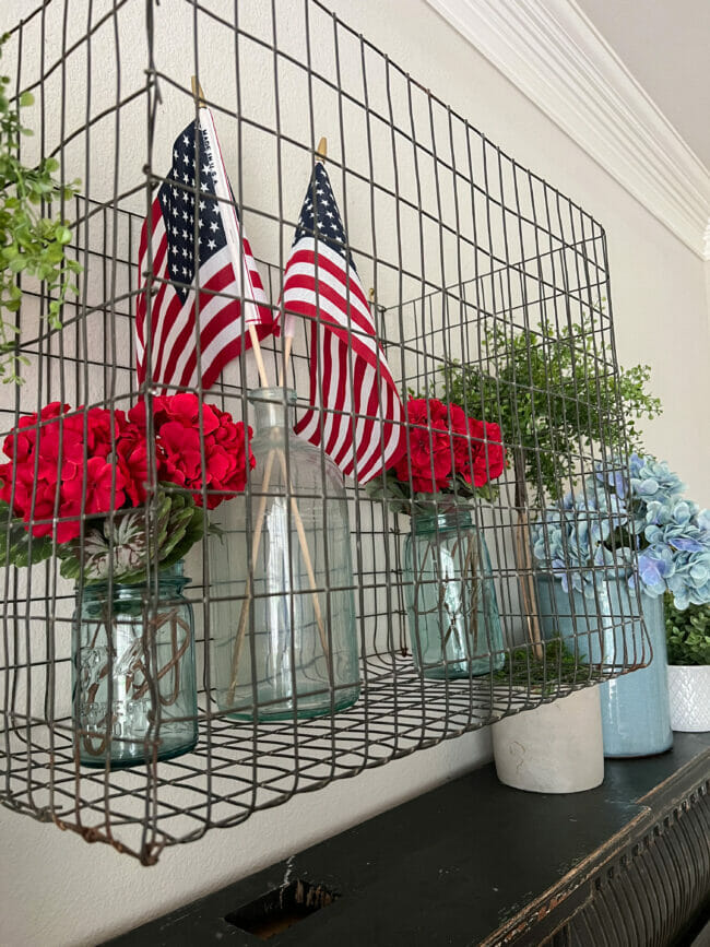 basket with flags and red geraniums