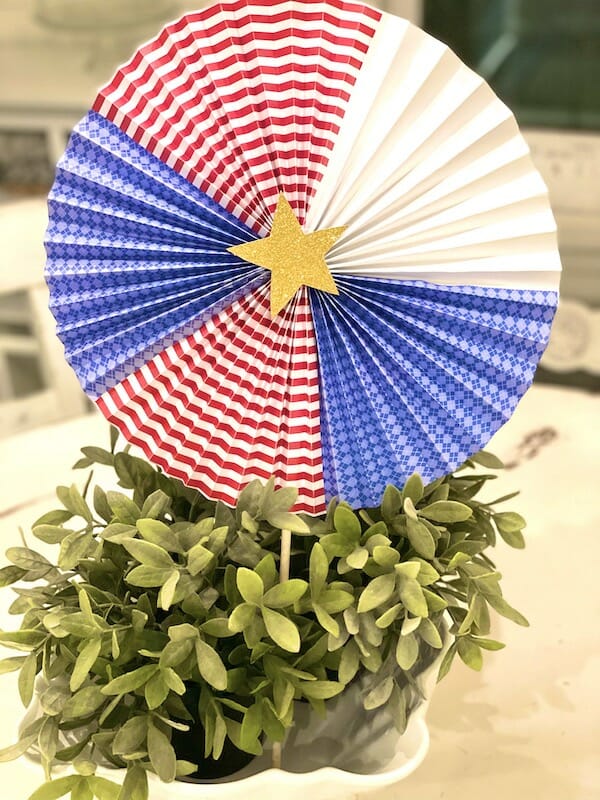 red, white and blue circular fan and boxwood planter