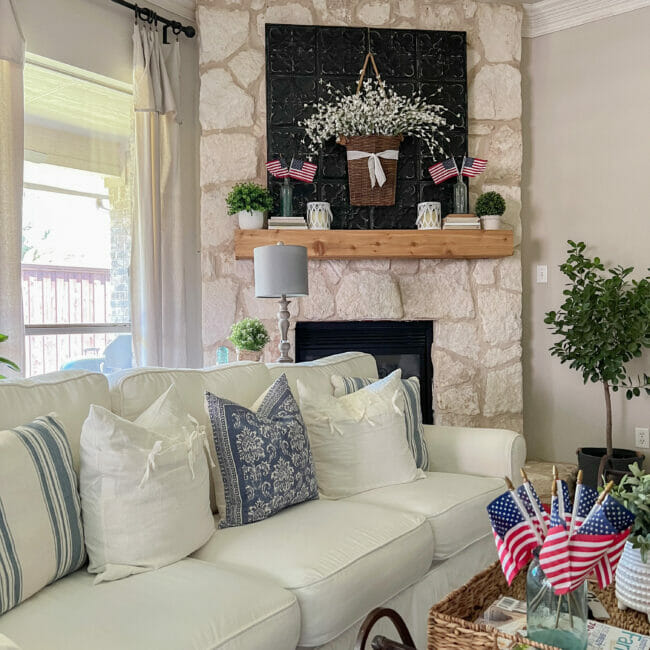 white sofa with mantel and flag decor