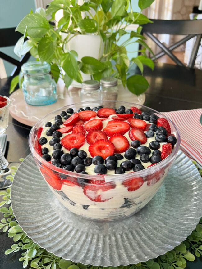 punch bowl cake with strawberries and blueberries