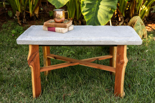 live edge wooden leg table with concrete top