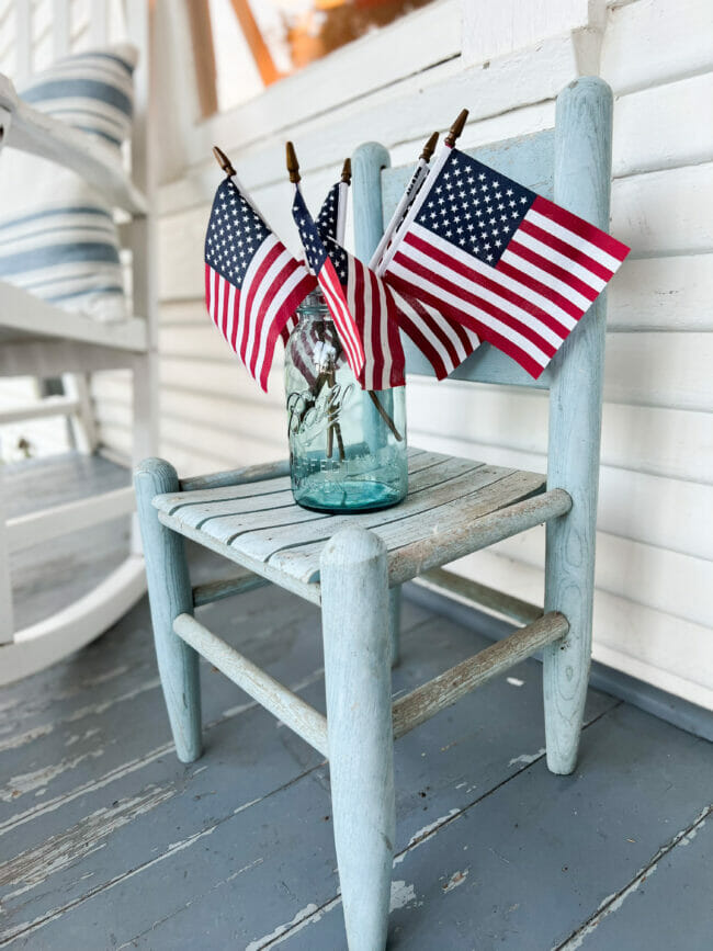 blue toddler chair with mini flags in a blue mason jar