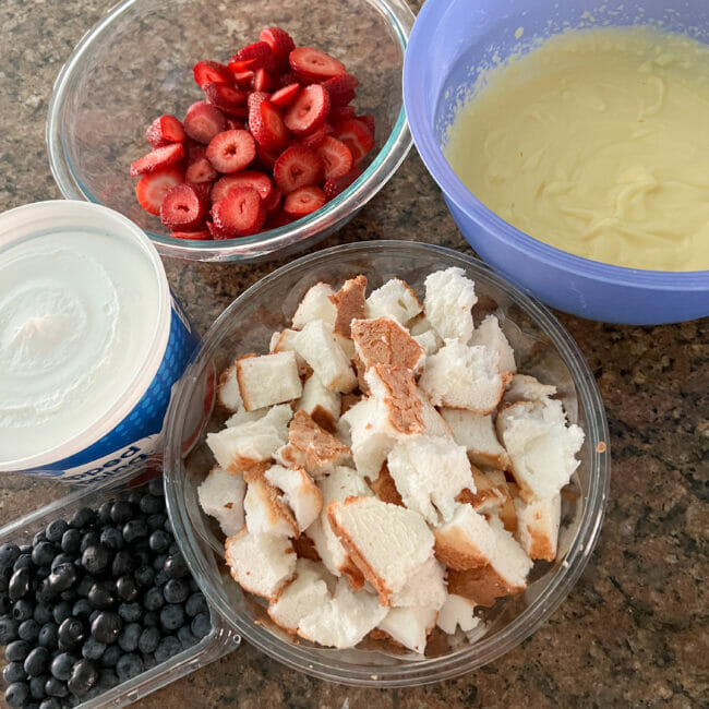 bowls if angel food cake, berries, cool whip and pudding