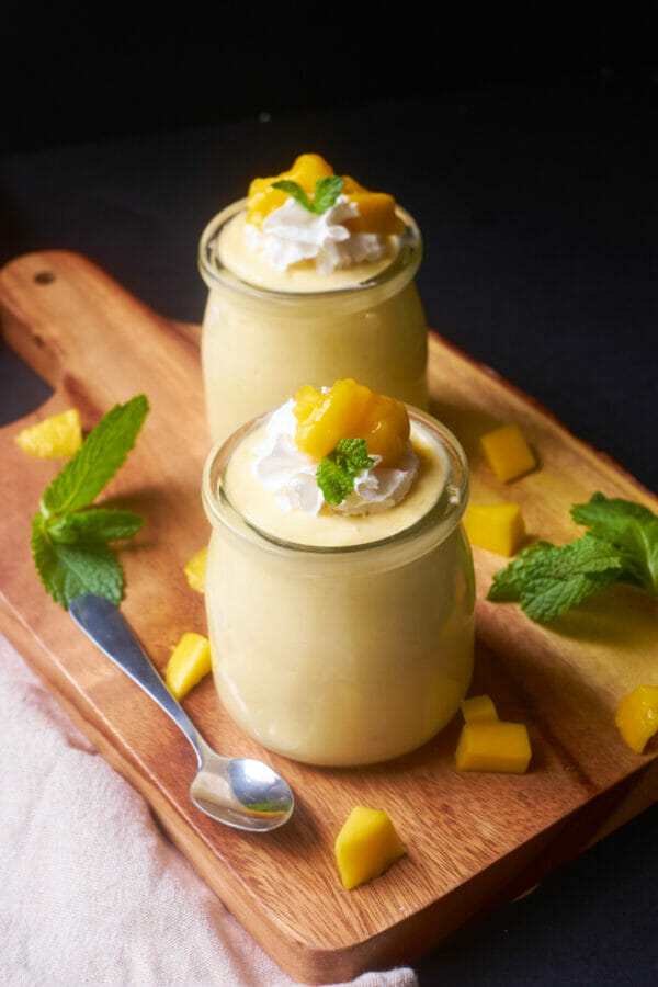 mango mousse in a jar with black background