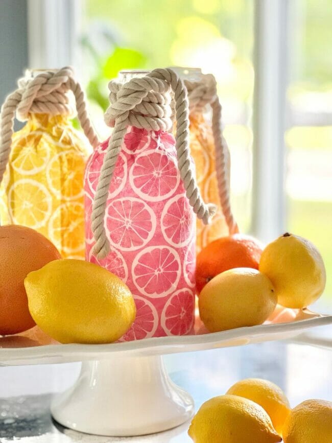 lemon and pink fruit bottles with rope around the handles