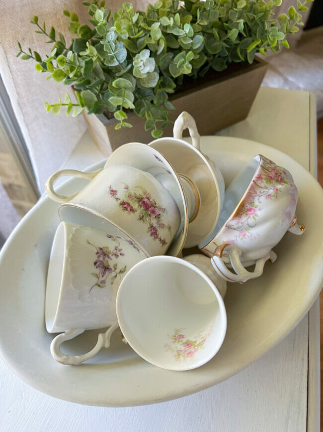 vintage teacups sitting in white bowl