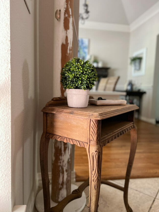 bleached wood table in entry