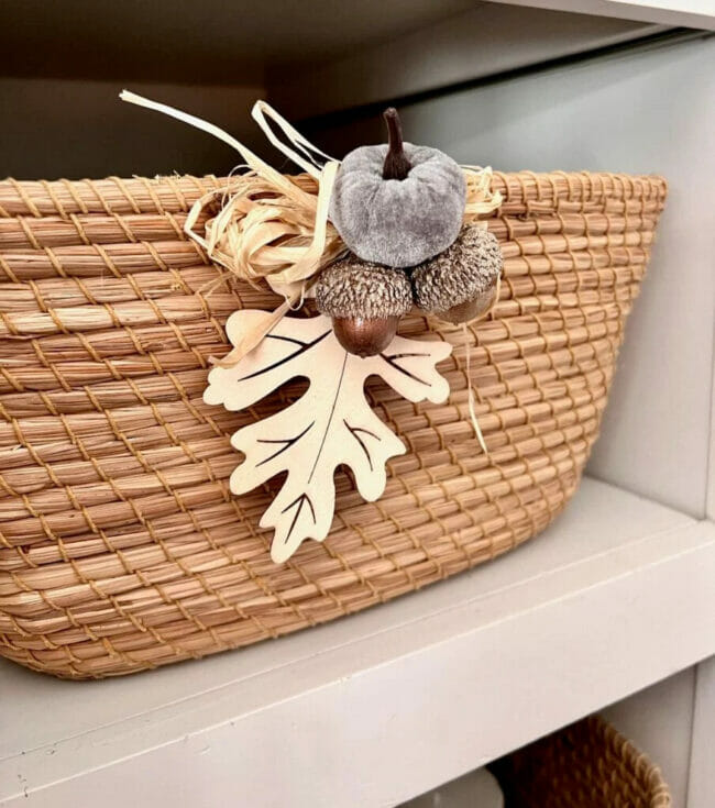 basket with fall pumpkin and leaves hanging on front