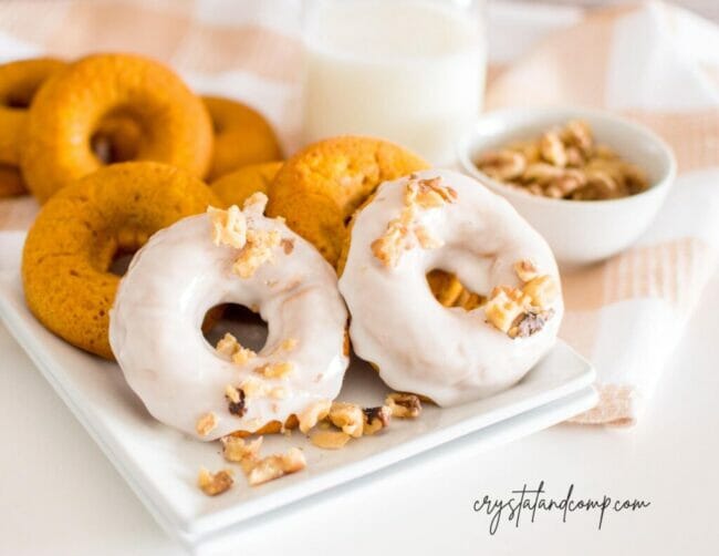 pumpkins iced donuts on white platter
